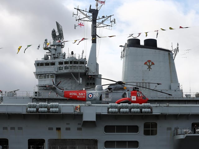 A Sea King helicopter rests on the flight deck of HMS Illustrious May 10, 2013. Photo by Dan Kitwood/Getty Images