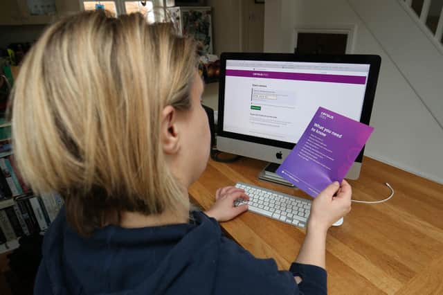 A woman completing the Census form. Picture: Jonathan Brady/PA Wire