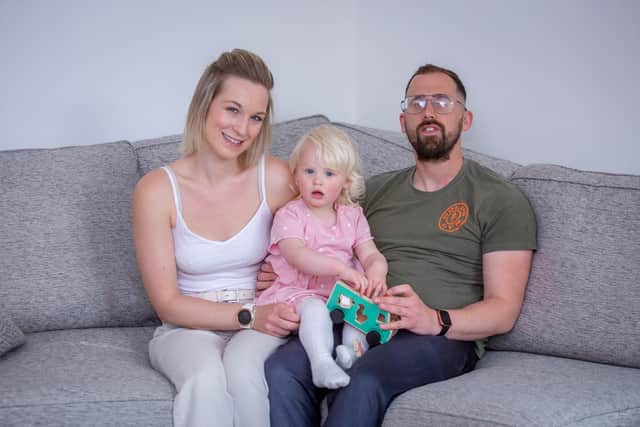 Glen Eastick is a personal trainer who had a stroke while giving an online PT session. Luckily his girlfriend Bex noticed and called an ambulance to get him into QA Hospital quickly. He has since had an operation to repair a hole in his heart that caused the stroke.Glen is calling for better awareness and more money to be spent on stroke awareness.Pictured: Glen Eastick with his girlfriend Bex and daughter, Evie, 2 at his home in Havant on Wednesday 11th May 2022Picture: Habibur Rahman