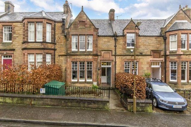 The property boasts a sandstone facade, original sash windows and panelled front door