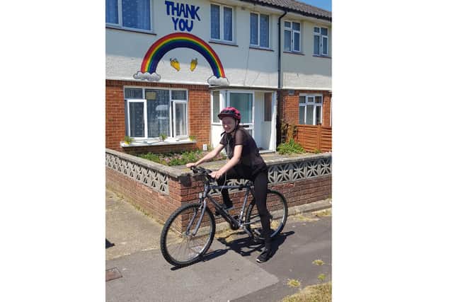 Rosie Deem, 14 from Gosport, is taking on a swimming, cycling and running challenge to raise funds for Cancer Research UK. Pictured: Rosie  on her first cycle of the challenge