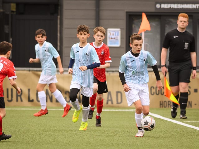 Action from the Portsmouth Youth League Geldard Invitation Cup final between Jubilee 77 U13s and Castle United U13s (light blue and white kit). Picture: Keith Woodland (190321-882)