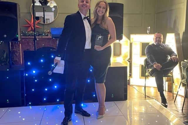 Managing director Daniel Byrne with award winner Claudia Richards