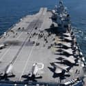 HMS Queen Elizabeth pictured with her embarked squadron of British and American F-35 jets.Photo: Royal Navy.