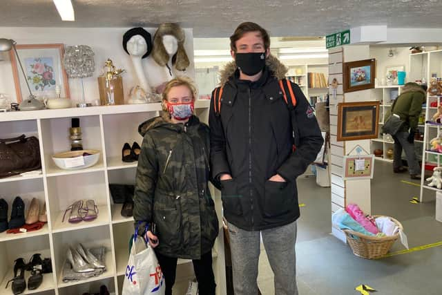 Bargain hunters Danni Mills, 20, and Connor Crosby, 22, from Fareham, were shopping in Farehams many charity shops. Pictured here in The Rainbow Centre shop in West Street.