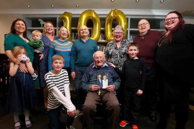 Jeff Broadhurst is a hundred. Mr Broadhurst, sitting centre, is pictured at Parker Meadows Carehome, Fareham, with family and well-wishers
Picture: Chris Moorhouse (jpns 070123-112)