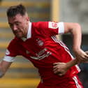 Ryan Edmondson of Aberdeen is challenged by Scott Arfield of Rangers FC during the Ladbrokes Premiership match between Aberdeen and Rangers at Pittodrie Stadium on August 01, 2020 in Aberdeen, Scotland. Football Stadiums around Europe remain empty due to the Coronavirus Pandemic as Government social distancing laws prohibit fans inside venues resulting in all fixtures being played behind closed doors. (Photo by Andrew Milligan/Pool via Getty Images)