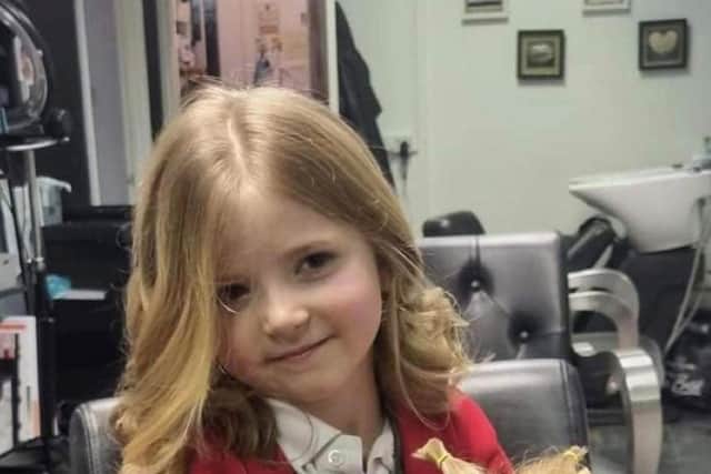 Haircut for Little Princess Trust
Caption: Five-year-old Gracie-Mae donates her hair to the Little Princess Trust
Credit: Mo Dunford