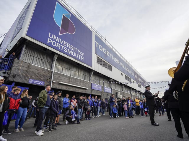 Fans gather to watch a military band play outside Fratton Park on Armistce Day.