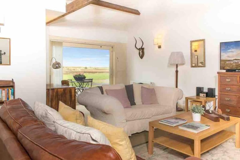 This cosy living offers incredible views of Almouth and space for a large family gathering or groups of friends.