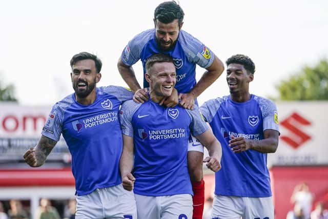Colby Bishop, centre, was Pompey's two-goal hero on Saturday     Picture: Jason Brown