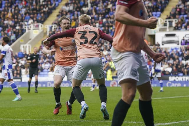 Terry Devlin celebrates with Paddy Lane after scoring the winner at Reading. Picture: Jason Brown