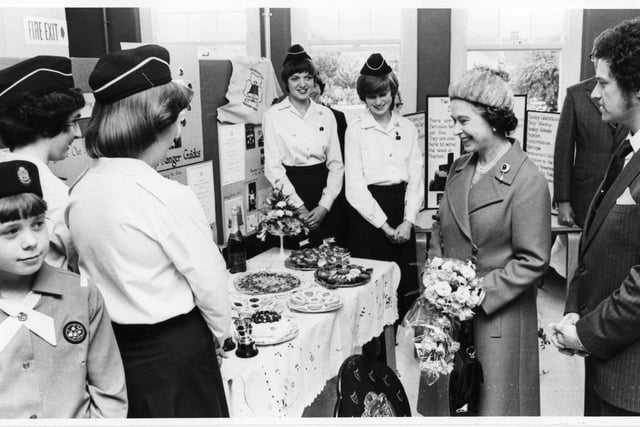 Queen Elizabeth enjoying a cookery display presented by Rangers at Trafalgar Place Community Centre, Fratton, Portsmouth July 1980. The News 2248-13