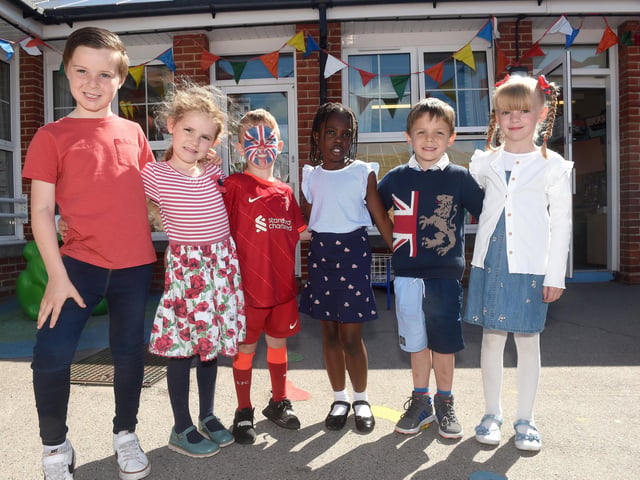 Pupils from Moorings Way Infant School in Southsea, celebrating The Queen's Platinum Jubilee. Pictured is: Max Dungworth (7), Maia Spencer-Haynes (5), Jake Shelton (6), Ayla Warsop (7), Thomas Reynolds (4) and Addison Pitcher (6).