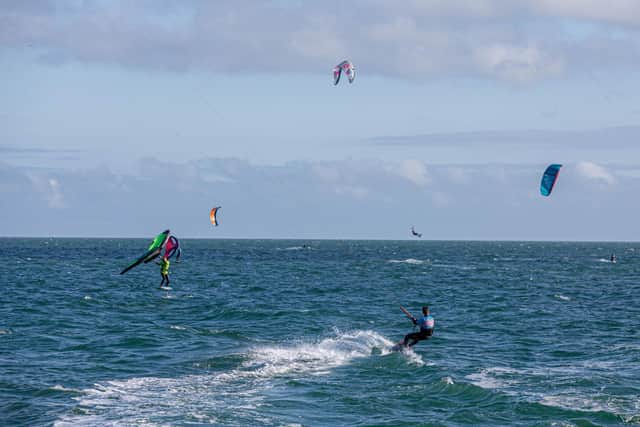 Kitesurfing Armada Festival at Hayling Island in 2021. Pictured: People kite surfing at Hayling Island. Picture: Habibur Rahman.