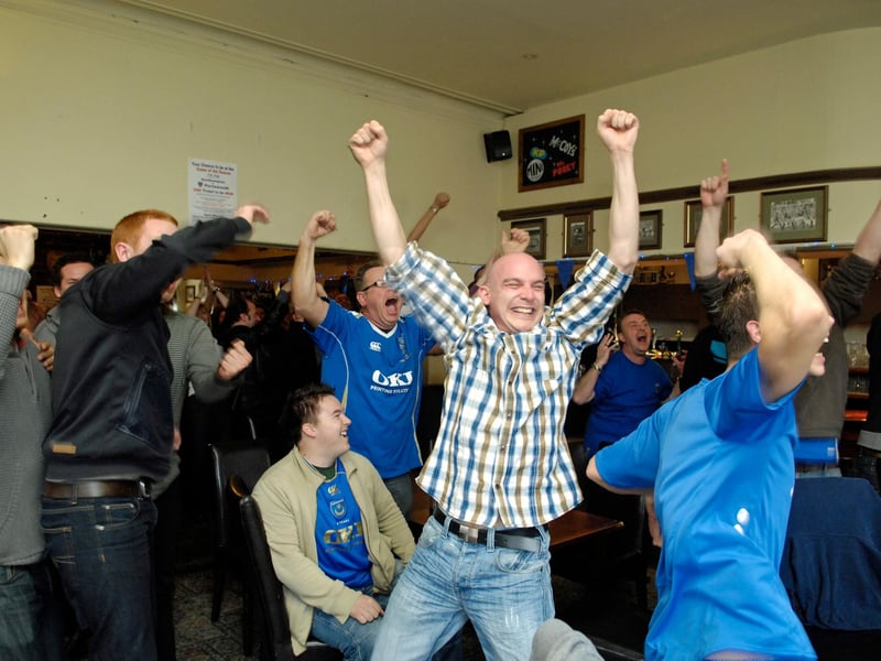 These Pompey fans celebrate the Blues' 4-1 win at Southampton in the FA Cup in 2010.