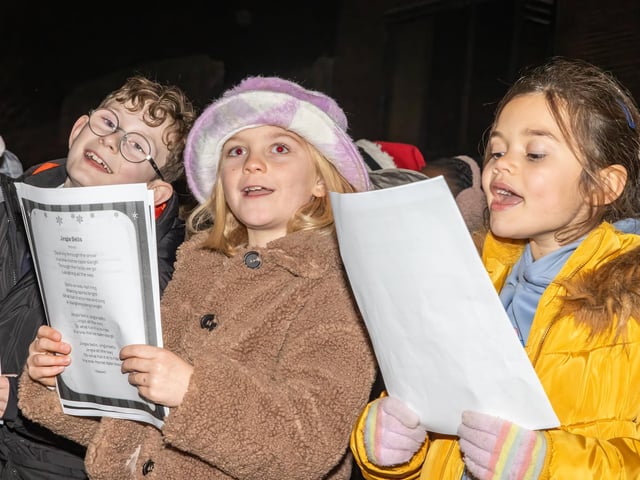 School choirs joined the Denmead Brass Band to sing Christmas carols.  Photos by Alex Shute