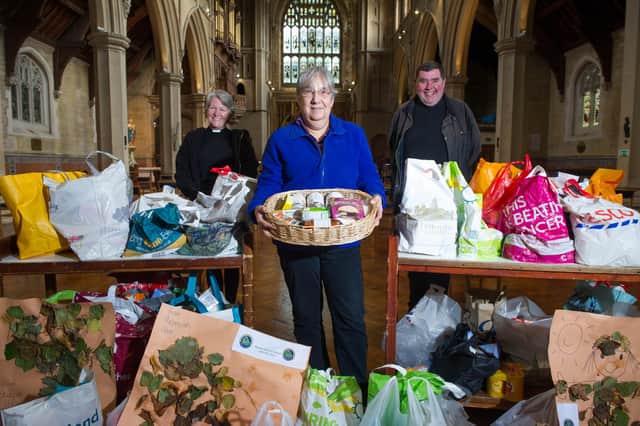 Father Bob and reverend Sam Collins handing over donations to Carole Damper from the Roberts Centre for the Harvest handover at St Maryâ€™s Church, Fratton, Portsmouth on 8 October 2020

Pictured: Reverend Sam Collins with Carole Damper and Father Bob.

Picture: Habibur Rahman