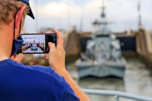 A sailor on Spey snaps Tamar in the lock on the Panama Canal. Photo: LPhot Rory Arnold