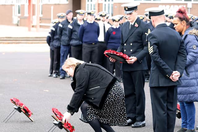 Families laying wreaths at HMS Sultan.