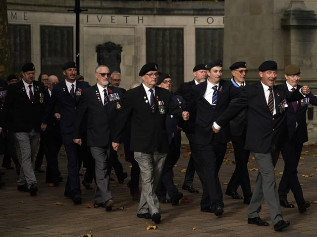 Veterans return from the City of Portsmouth War Memorial towards Guildhall Square