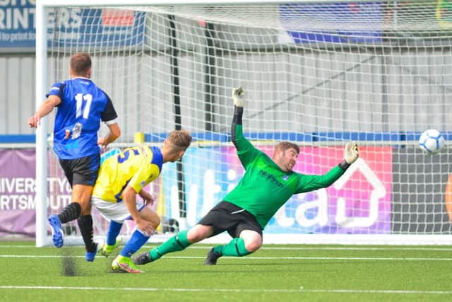 Clanfield keeper Gareth Wiseman can't stop this Denmead shot. Picture: Martyn White