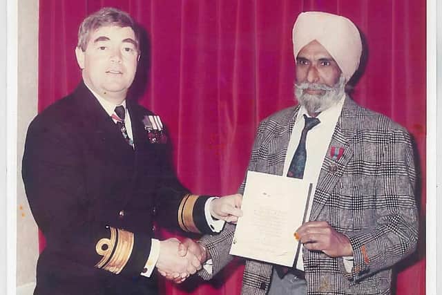 Shingar Singh Taak receiving the Imperial Service Medal for 25 years of dedication in Portsmouth Dockyard
