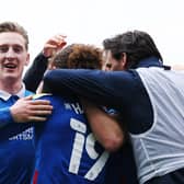 Ronan Curtis celebrates with his team-mates