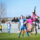 Moneyfields defender Tom Cain challenges the Amesbury goalkeeper. Picture by Dave Bodymore.