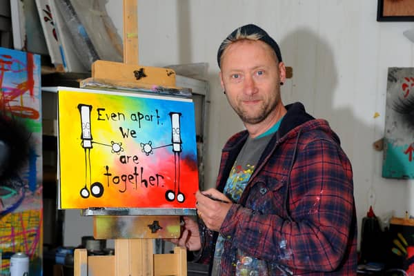 Artist My Dog Sighs with artwork he created for The News, Portsmouth, which was sold to raise money for charity.

Picture: Sarah Standing (010520-8199)