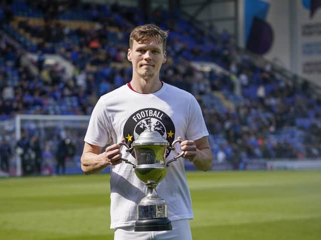 Sean Raggett is ready to hand over the The News/Sports Mail Player of the Season trophy he won for 2021-22. Picture: Jason Brown/ProSportsImages