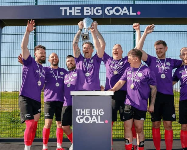 Onecom lifting The Big Goal trophy after winning the Southern Regionals