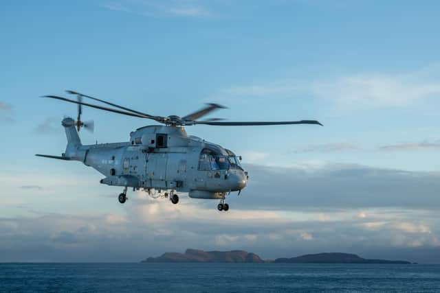 A Merlin Mk2 ASW Helicopter, Mohawk Flight of 814 Squadron, RNAS Culdrose, Callsign Redclaw departing with the Isle of Skye in the background.
