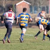 Hat-trick hero Robert Ellis, right, shows another side to his game with a hard-hitting tackle in Gosport & Fareham's win over Sandown & Shanklin Picture: Martin Burnett