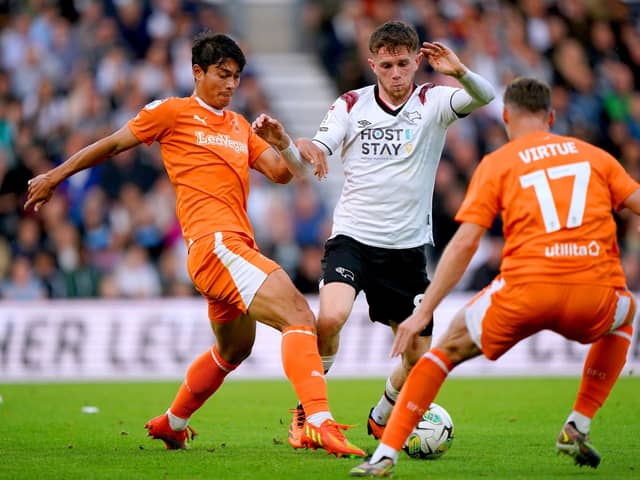 Blackpool claimed a 2-0 victory over Derby County