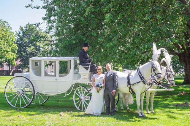 Paris and Matt with their horse and carriage outside St Mary's Church, Fratton. Picture: Carla Mortimer Photography.