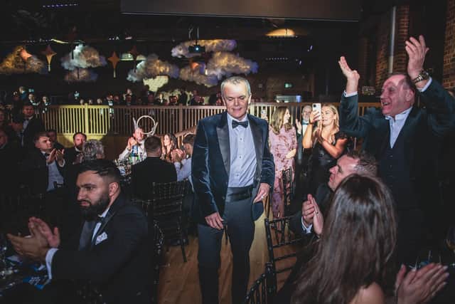 Stephen Snow approaches the stage to collect his Lifetime Achievement Award