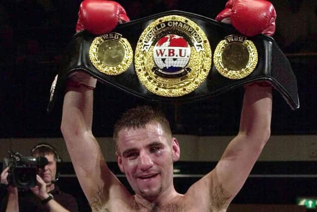 Flashback - Tony Oakey holds aloft his WBU world light heavyweight championship belt after beating Kostyantyn Schvets in March 2002. Pic: AP Photo/Richard Lewis.