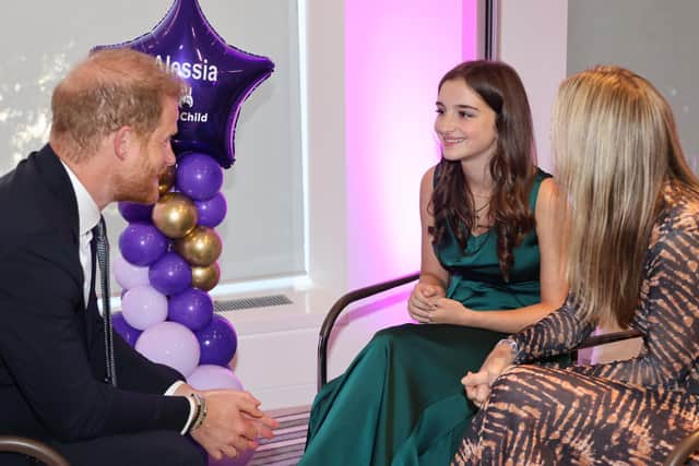Alessia Palikira meeting WellChild Patron Prince Harry as she wins a WellChild Award in the sibling catergory