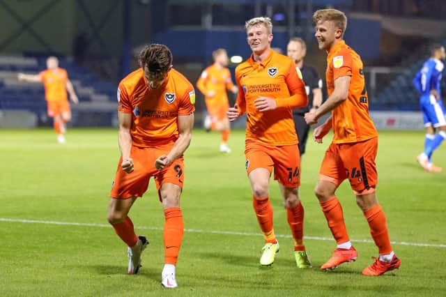 John Marquis celebrates his opener as Pompey bounced back to register victory at Gillingham on Tuesday night. Picture: Nigel Keene/ProSportsImages