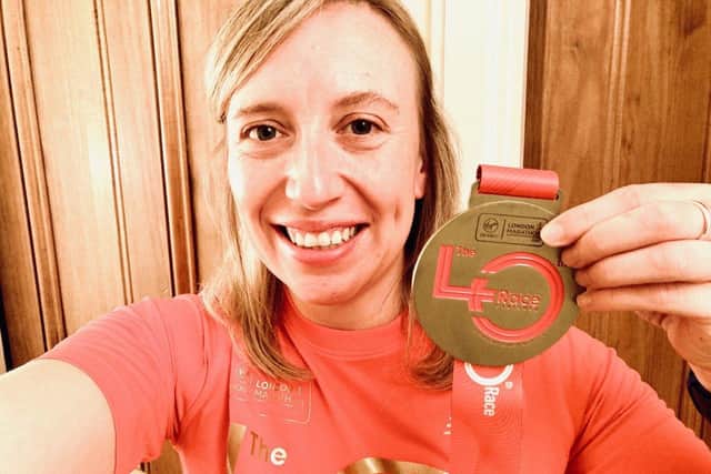 Bianca Junge with her medal for running a virtual London Marathon.