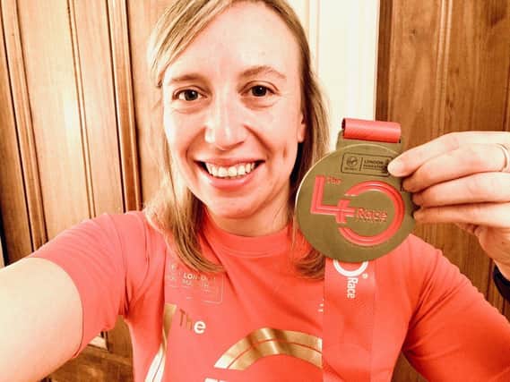 Bianca Junge with her medal for running a virtual London Marathon.
