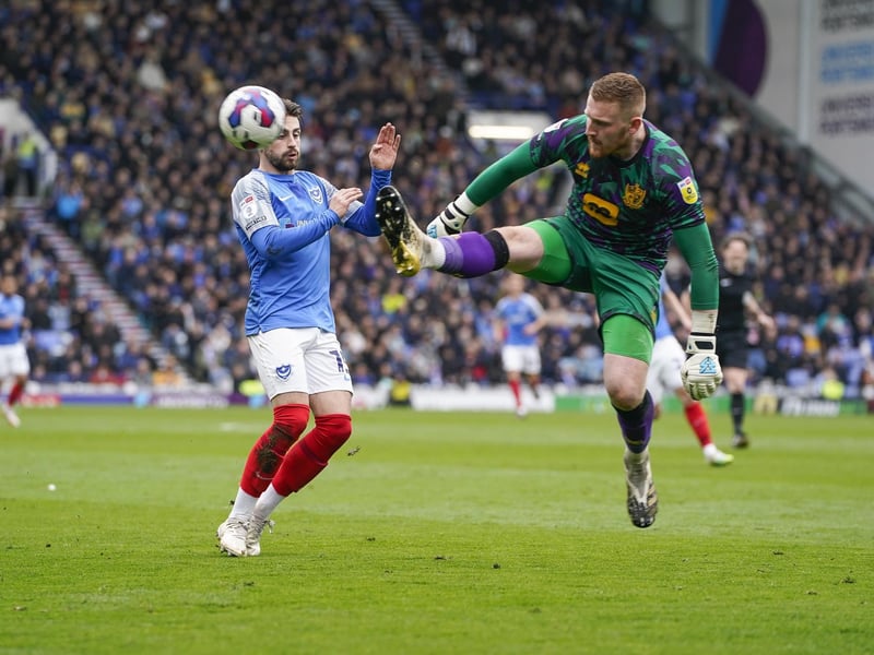 Port Vale goalkeeper Aidan Stone intercepts the ball ahead of Pompey's Owen Dale at Fratton Park. Picture: Jason Brown/ProSportsImages