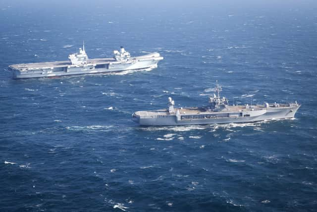 HMS Prince of Wales, top, pictured with the USS Mount Whitney