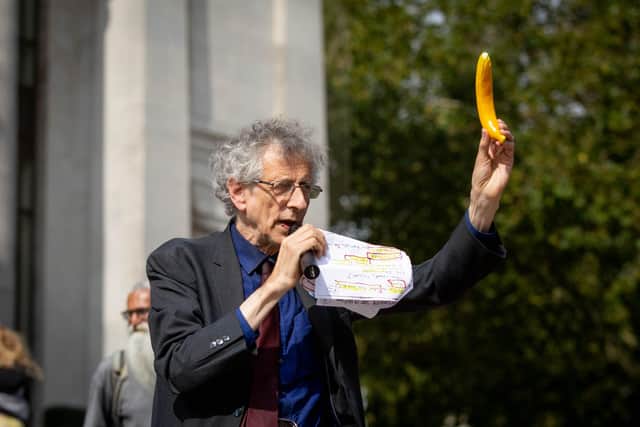 Bananas:  Piers Corbyn waggles a plastic banana in the air as he told the crowd they shared DNA with the popular yellow fruit
Picture: Habibur Rahman