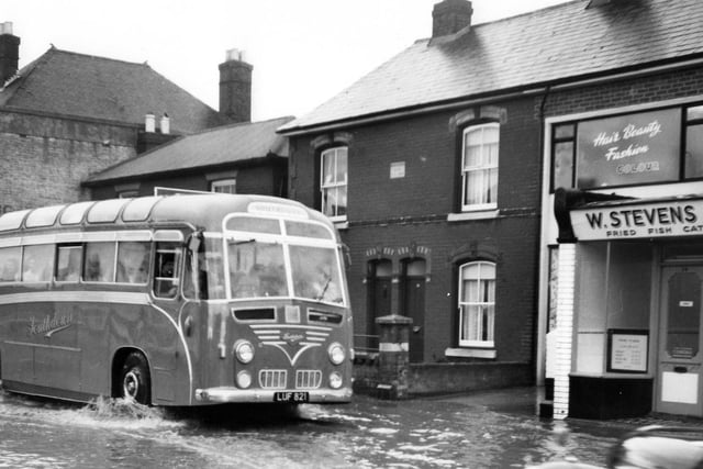 Portchester flood.
A Southdown coach makes a bow wave through Portchester.