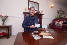 Chris Pitman with photos and letters from her late father at her home in Bedhampton.

Picture: Habibur Rahman