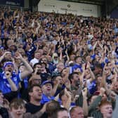The Fratton End showing their passion during the win against Lincoln. Pic: Jason Brown.
