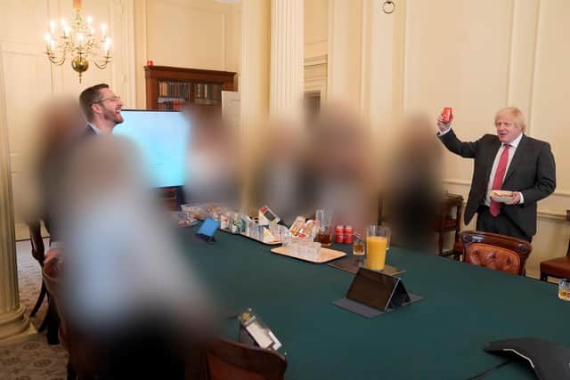 Picture shows Boris Johnson (right) at a gathering in the Cabinet Room in 10 Downing Street on his birthday, which has been released with the publication of Sue's Gray report into Downing Street parties in Whitehall during the coronavirus lockdown. Issue date: Wednesday May 25, 2022.