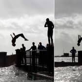 Thrill-seekers pictured backflipping into Emsworth Harbour as Storm Eunice rages. Photo: Habibur Rahman
